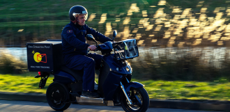 man riding on electric vmoto scooter