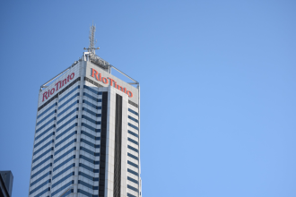 The Rio Tinto building in Perth, Western Australia, stands before a blue sky