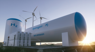 Digital render of a conceptual design for a green hydrogen manufacturing plant storage solution with wind turbines featured in the background as the sun straddles the horizon