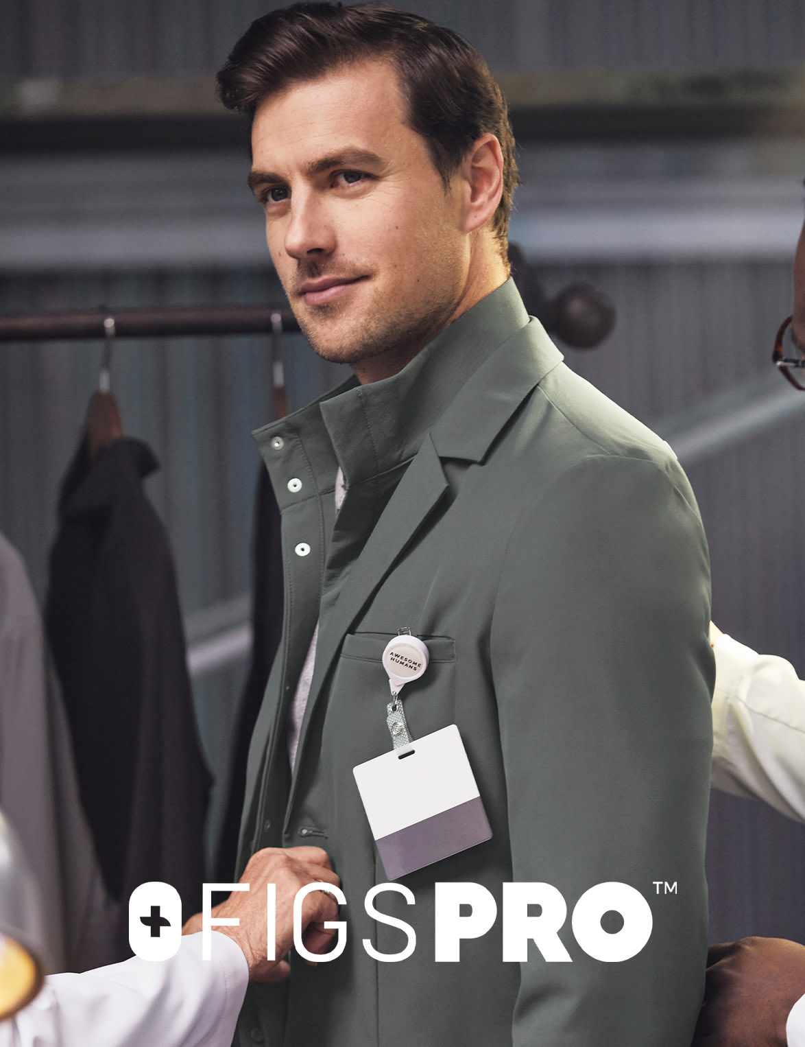 FIGSPRO™ High Collar Lab Coat — Engineered with nine pockets, a slim fit, and a liquid repellent inner collar to keep you covered.