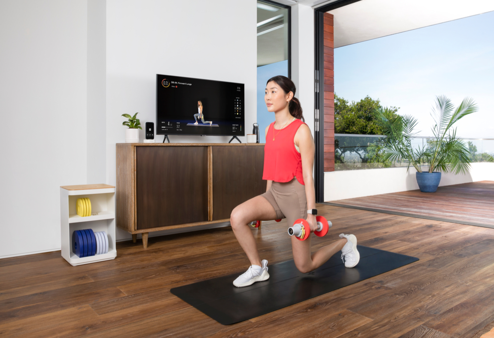 Woman red shirt dumbbell forward lunge with Tempo Move