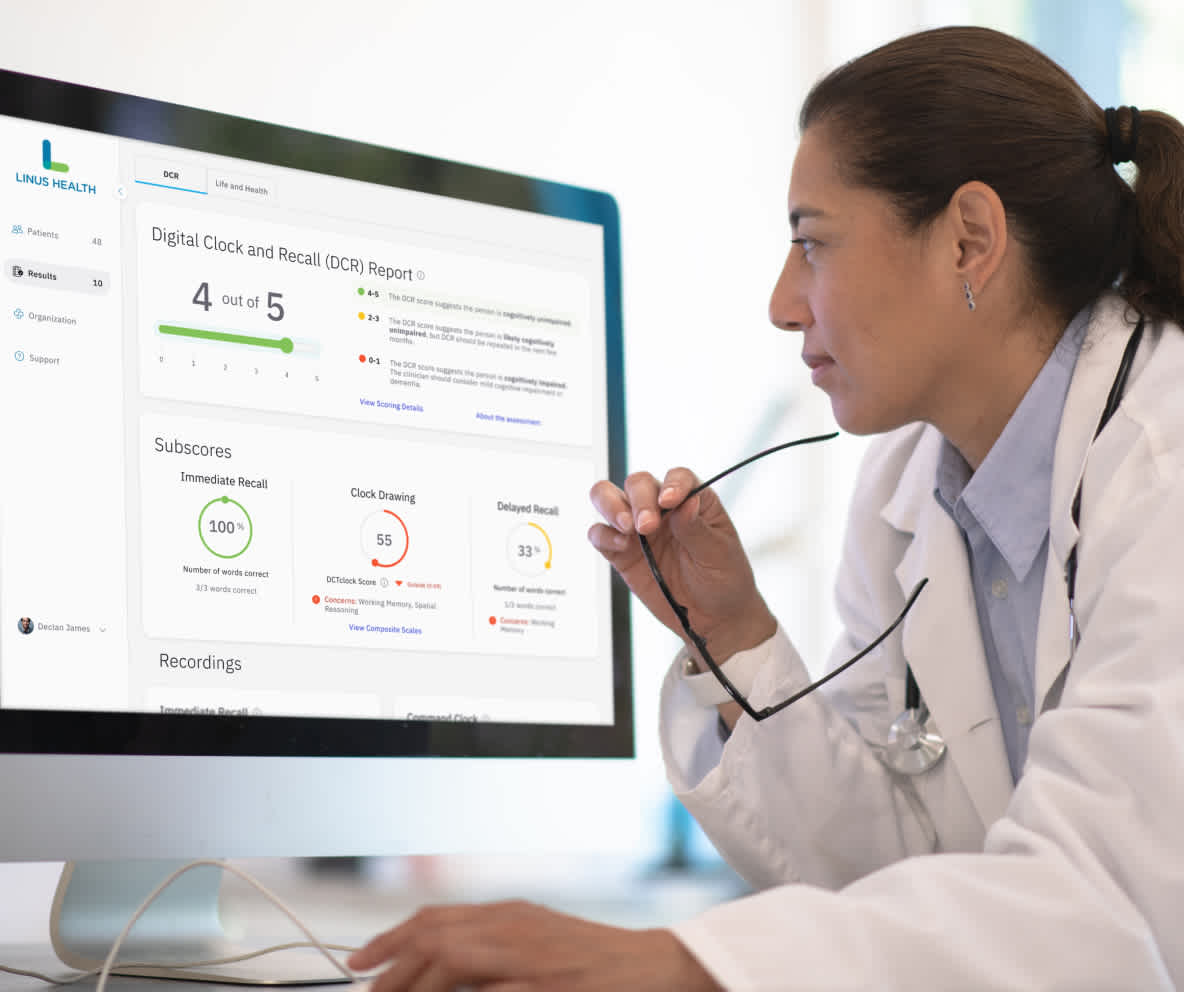 Physician reviews Digital Clock and Recall report results on desktop screen