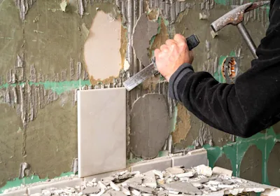 removing-old-tiles-from-wall-hammer-chisel