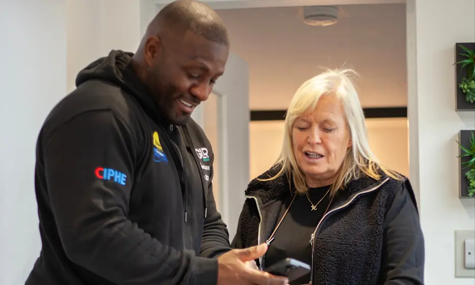 A tradesperson consulting with a homeowner