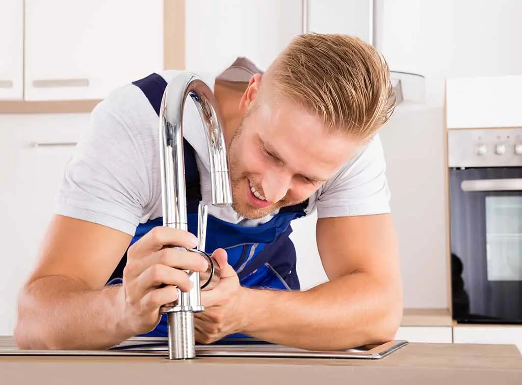 Why is my kitchen tap leaking from the base?