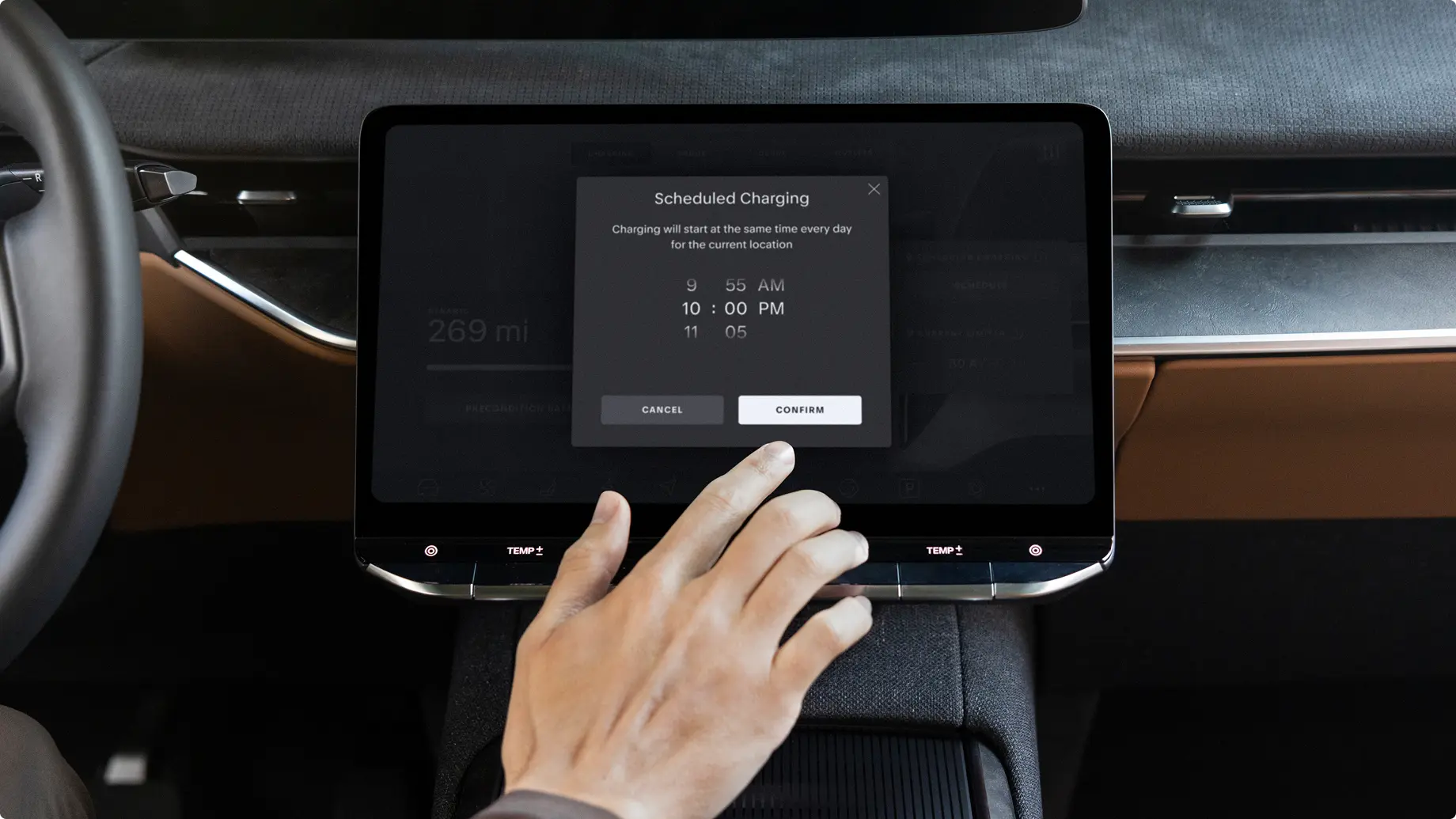 Hand touching dashboard screen showing scheduled charging options with multiple time slots and confirm button.