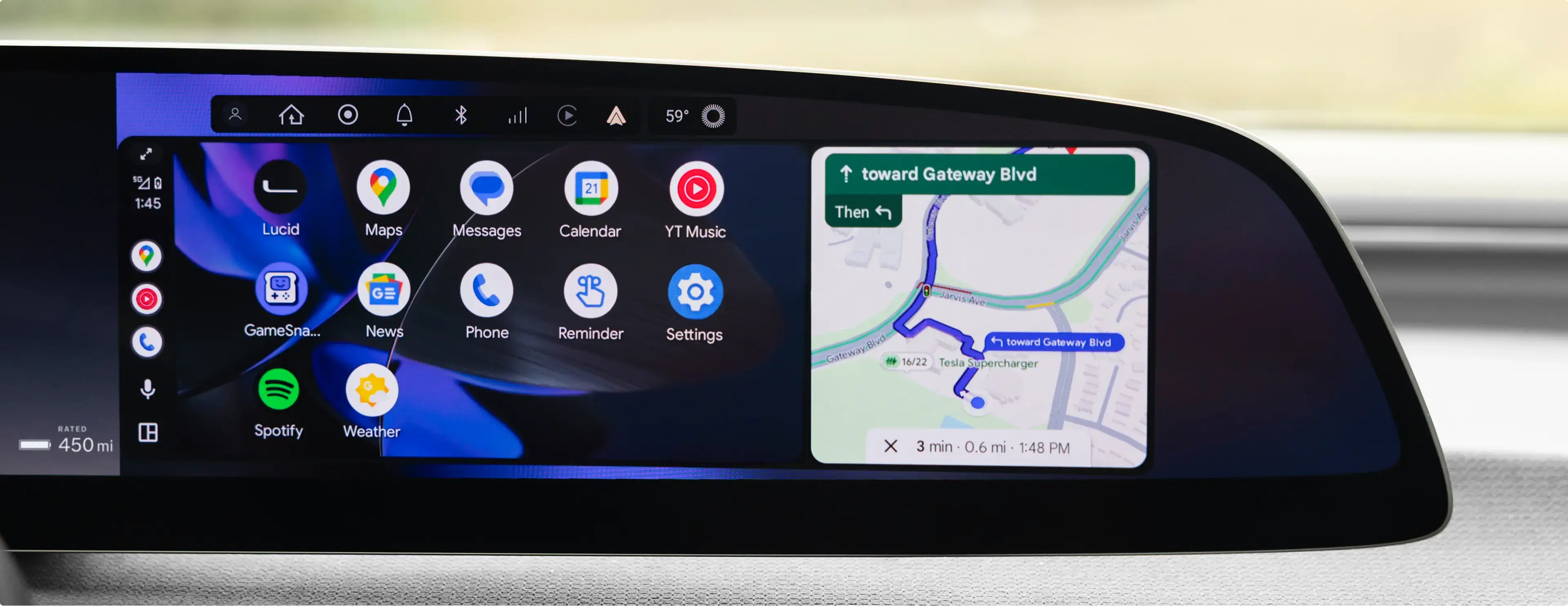 Car dashboard display showing Android Auto interface with app icons and navigation map directing toward Gateway Boulevard.