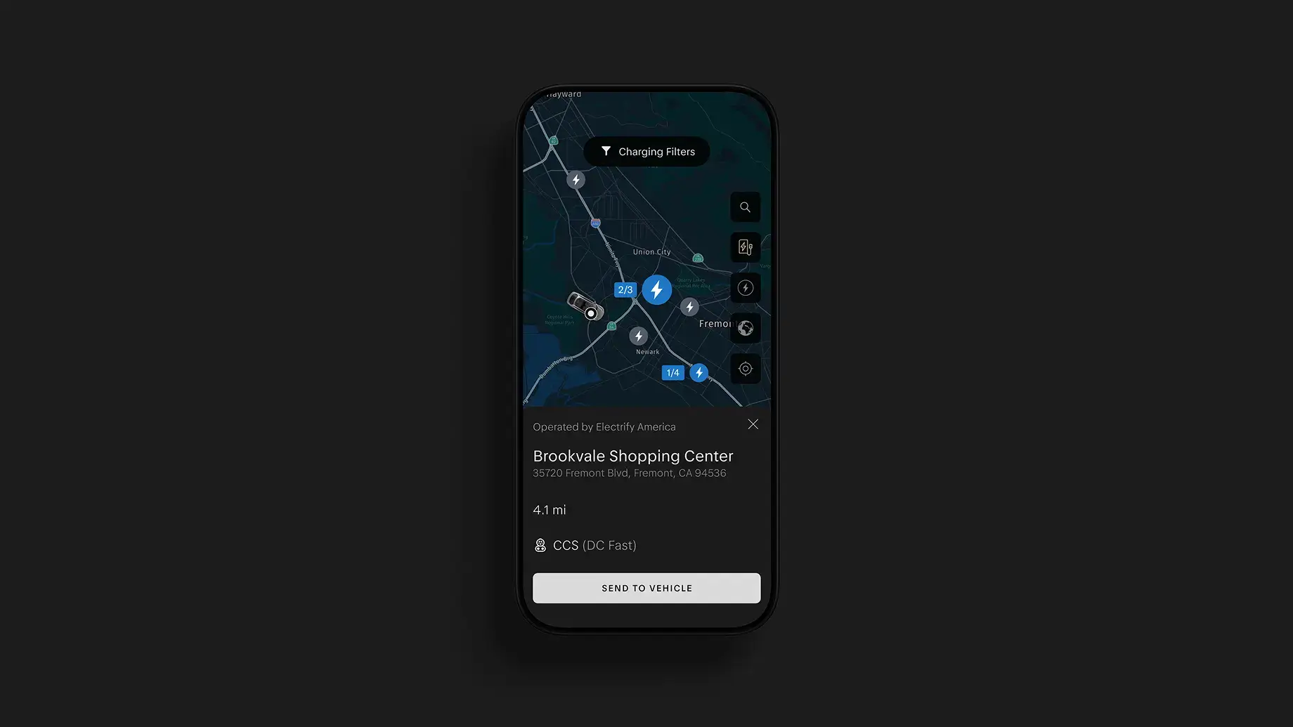A smartphone displays an EV charging app map showing nearby charging stations, with details for Brookvale Shopping Center in Fremont, CA.