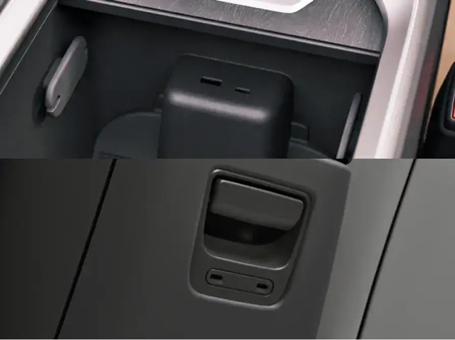 Black storage compartment in a vehicle console shown from two angles, with silver trim surrounding the compartment.