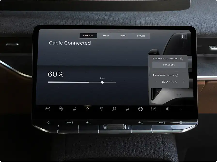 Electric vehicle dashboard display showing 60% battery charge with cable connected and charging settings menu visible.