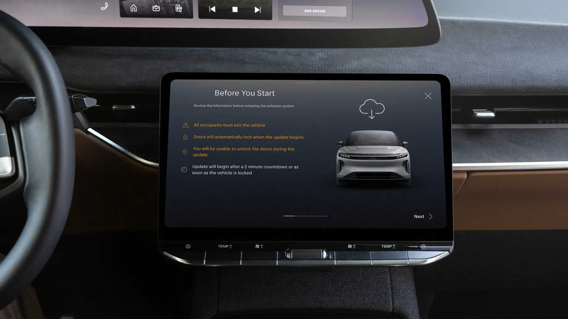 Car touchscreen displaying a "Before You Start" software update screen with safety instructions and a vehicle graphic.