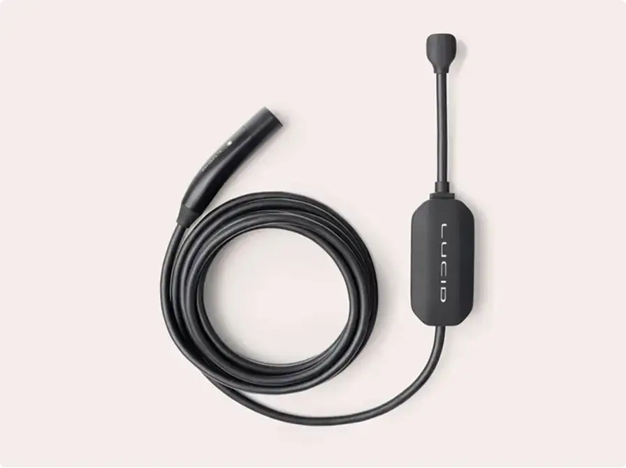 Black Lucid branded EV charging cable coiled on a light background, with a connector plug and inline control unit.