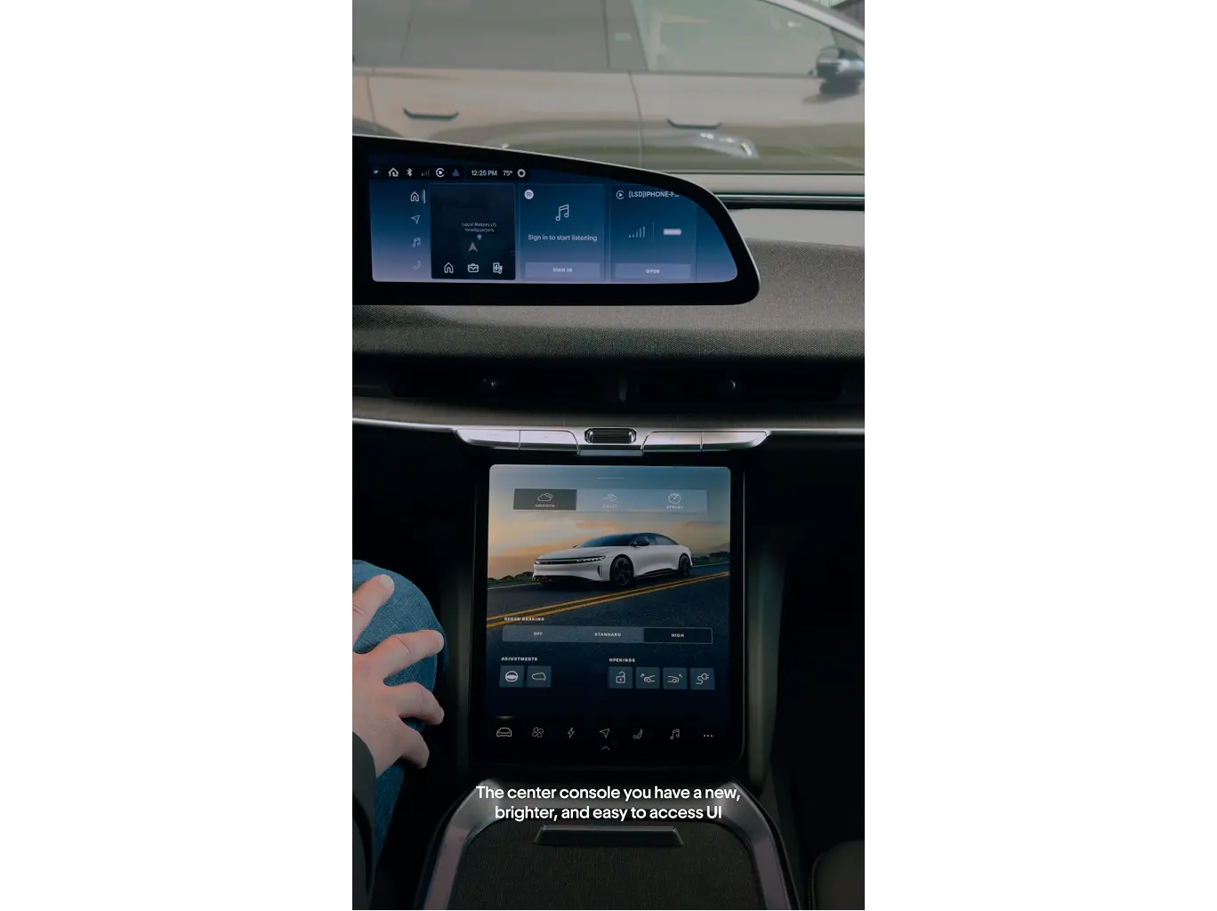 Car interior showing dual touchscreens with a bright UI displaying navigation, music, and vehicle controls.