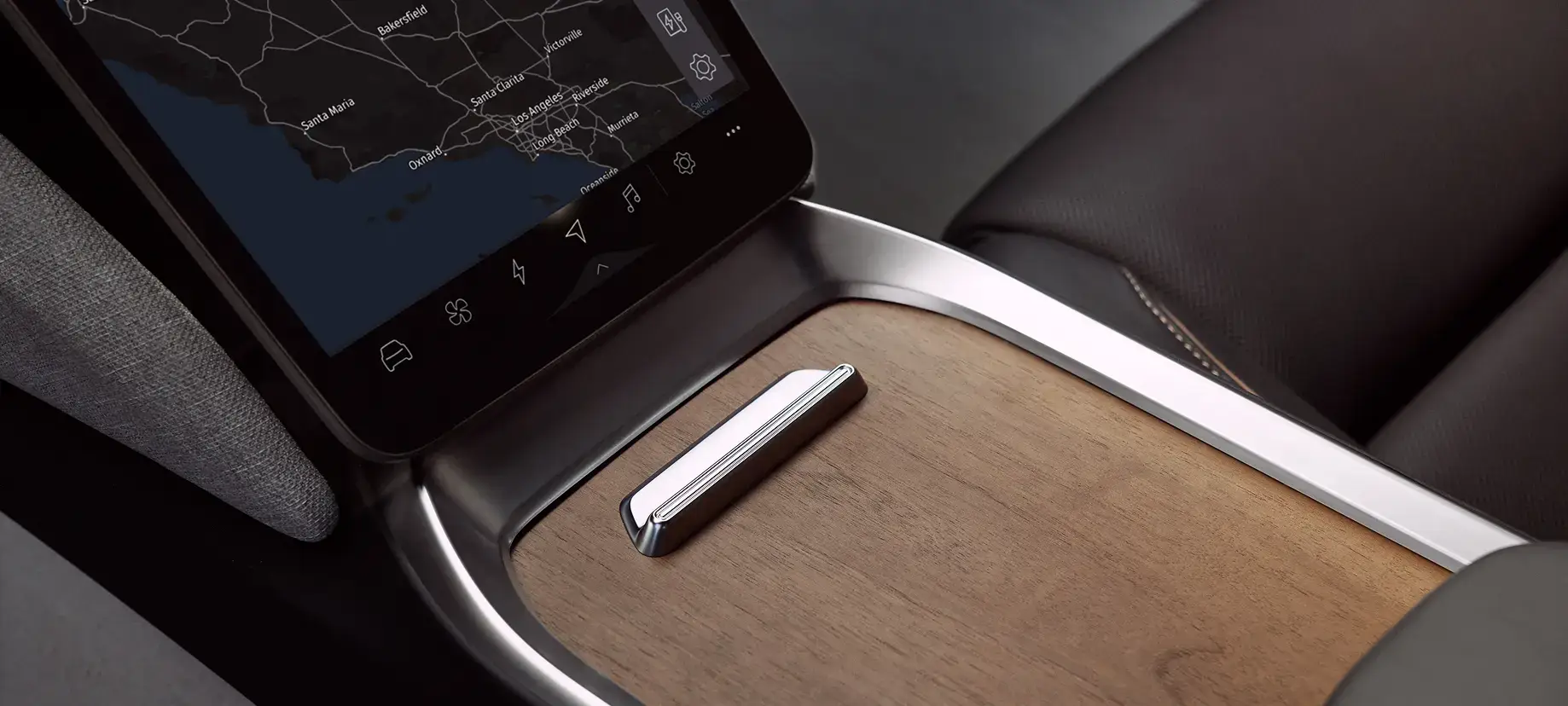 Car interior center console with a touchscreen displaying a dark map, wood trim, and a silver gear shift lever.