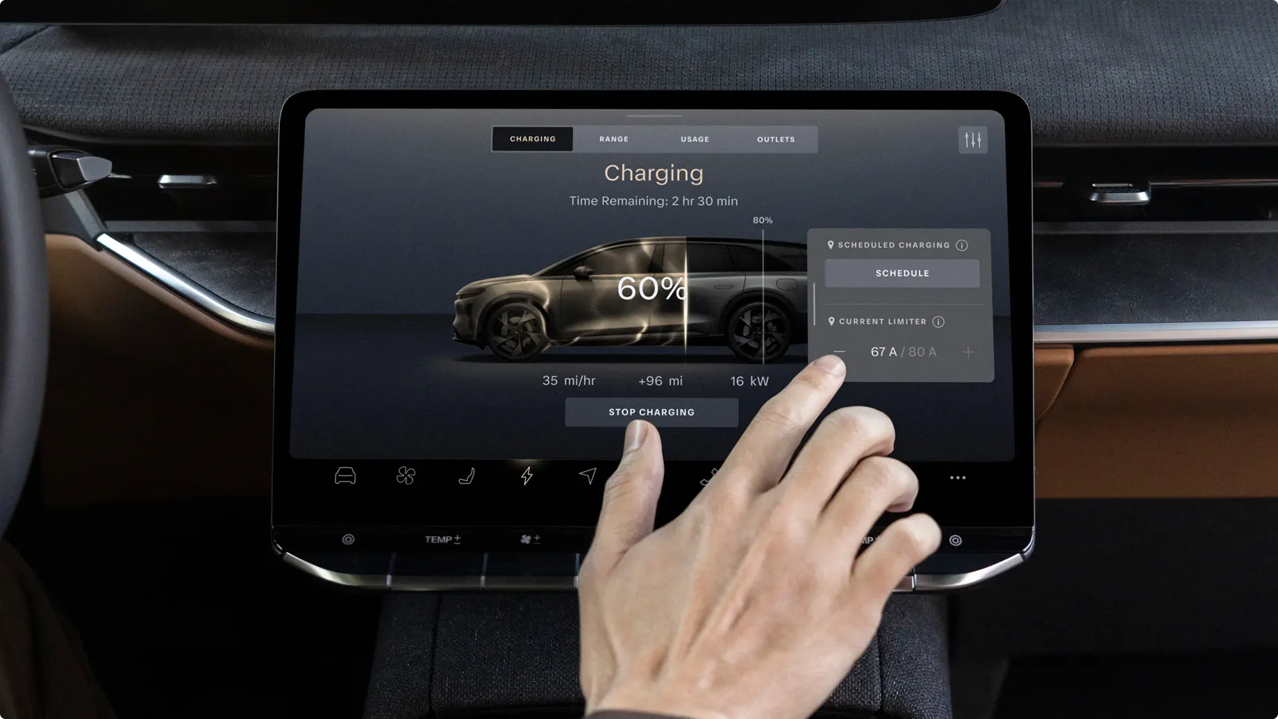 Electric vehicle dashboard display showing charging status at 60% with 2hr 30min remaining, hand touching screen interface.