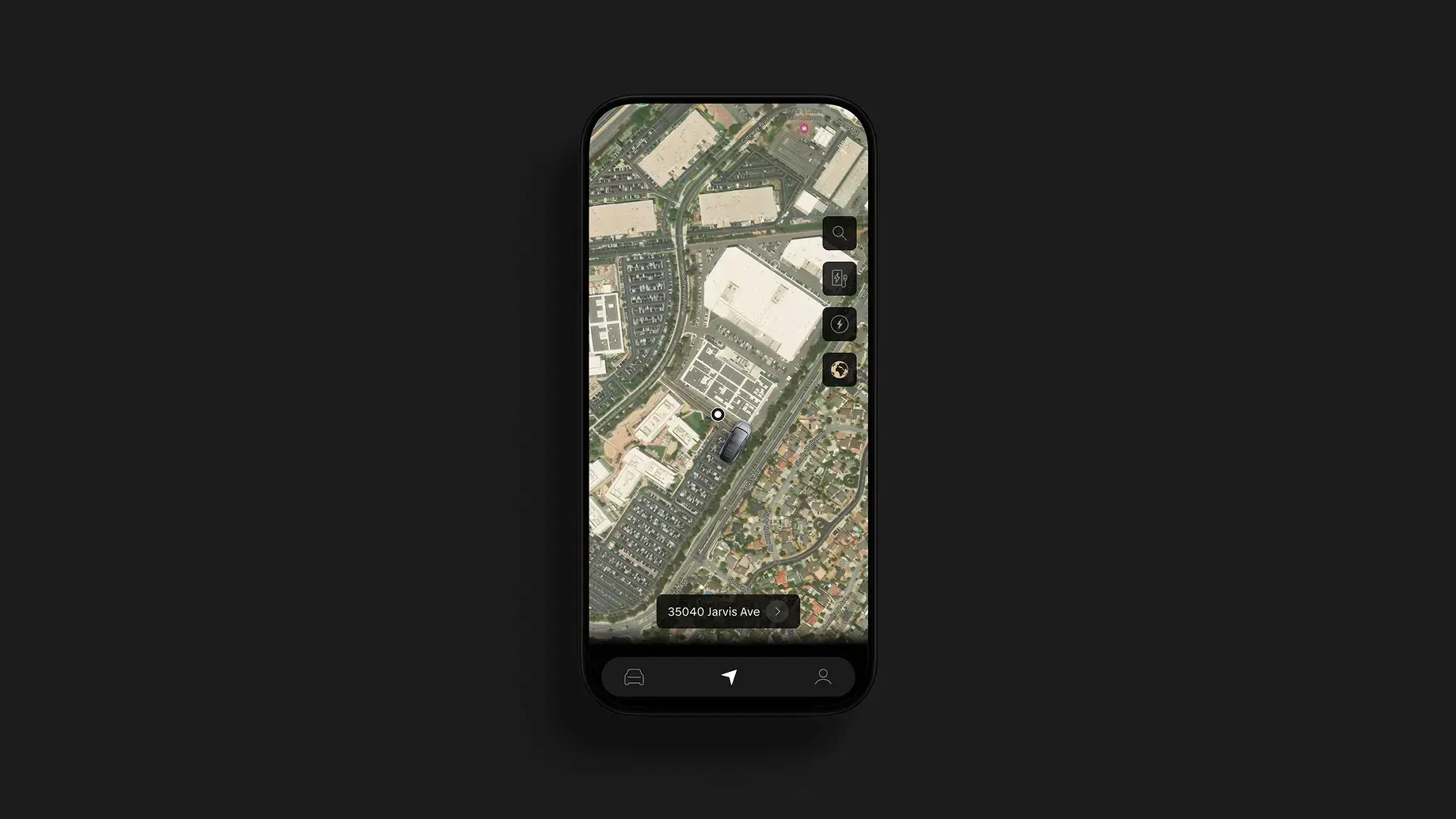 Smartphone displaying a Tesla app with a satellite map view showing a car's location at 35040 Jarvis Ave.