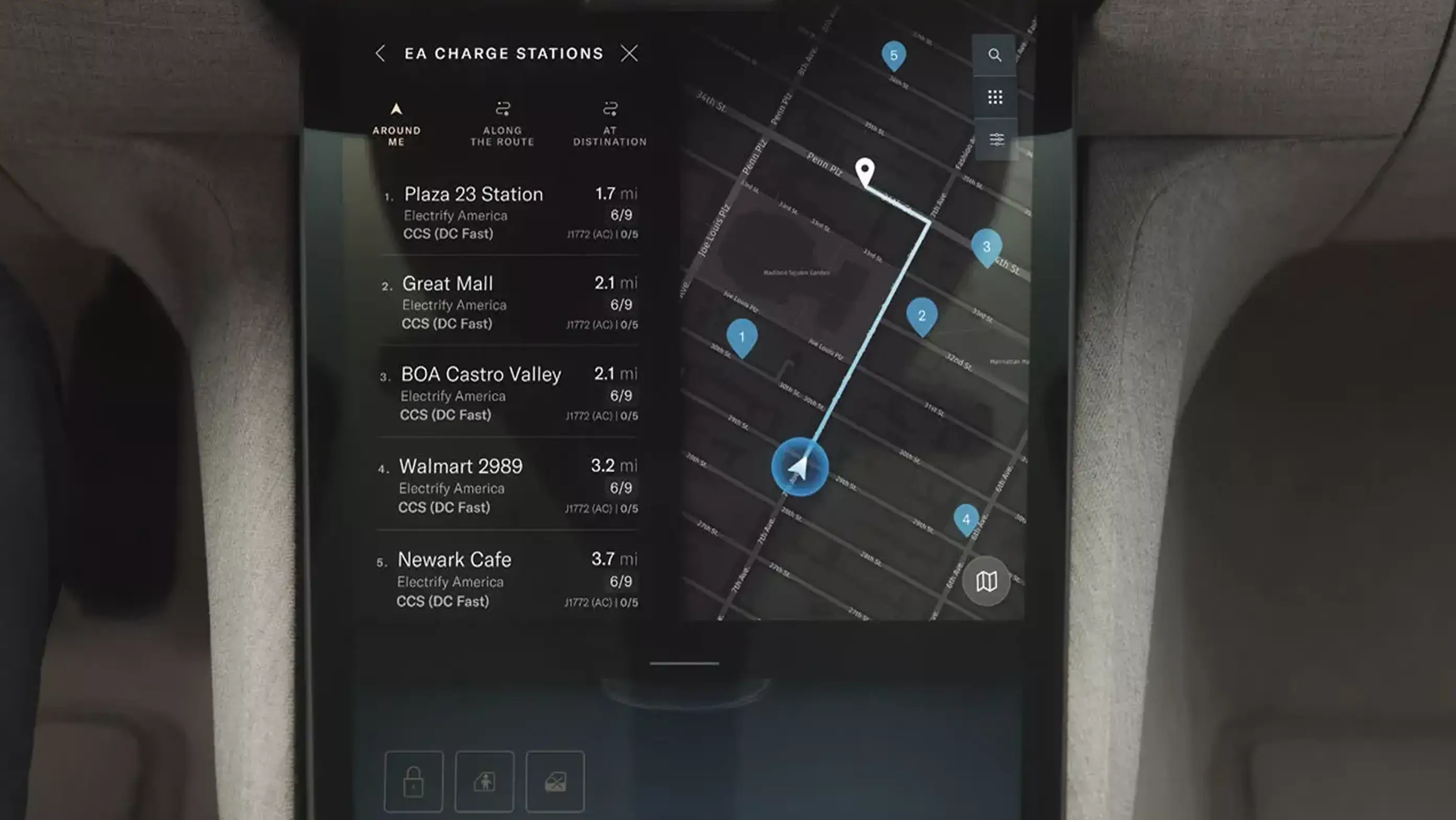 Car dashboard display showing nearby EA charging stations with distances and availability on a dark map interface.