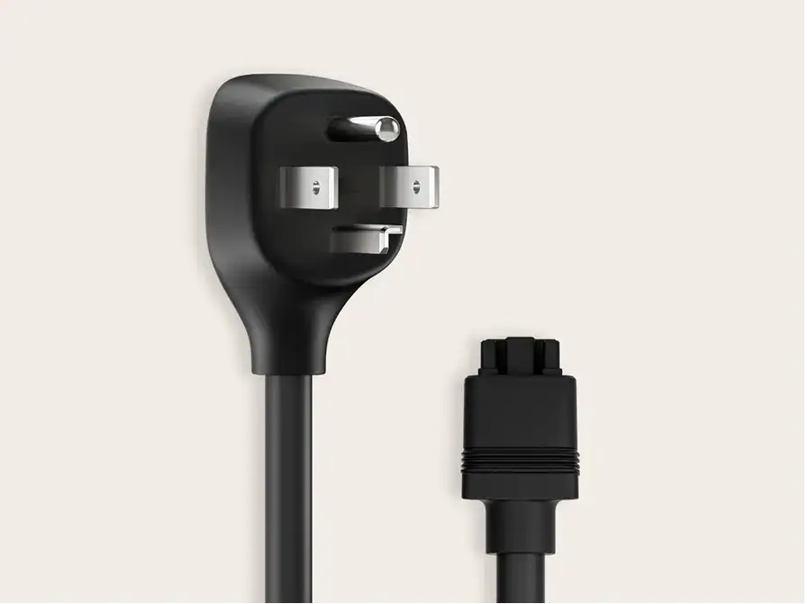 Black flat-angle power cord with a 3-prong plug on one end and a round connector on the other, on a light background.