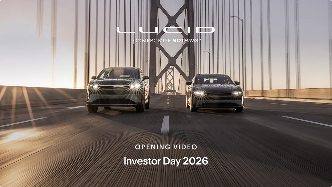 Two Lucid electric vehicles driving on a bridge with headlights on, featuring "Compromise Nothing" slogan and "Investor Day 2026" text.