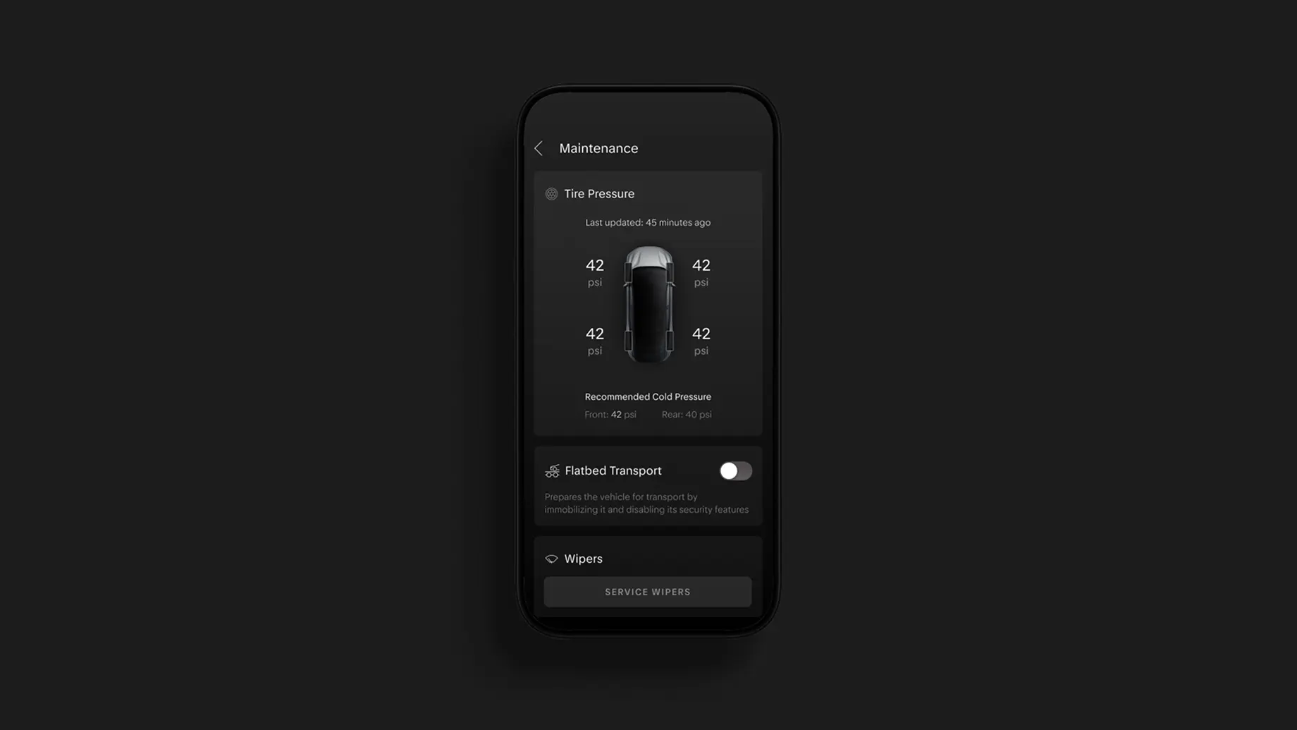 Dark-themed mobile app screen showing vehicle maintenance menu with tire pressure readings, flatbed transport toggle, and wipers section.