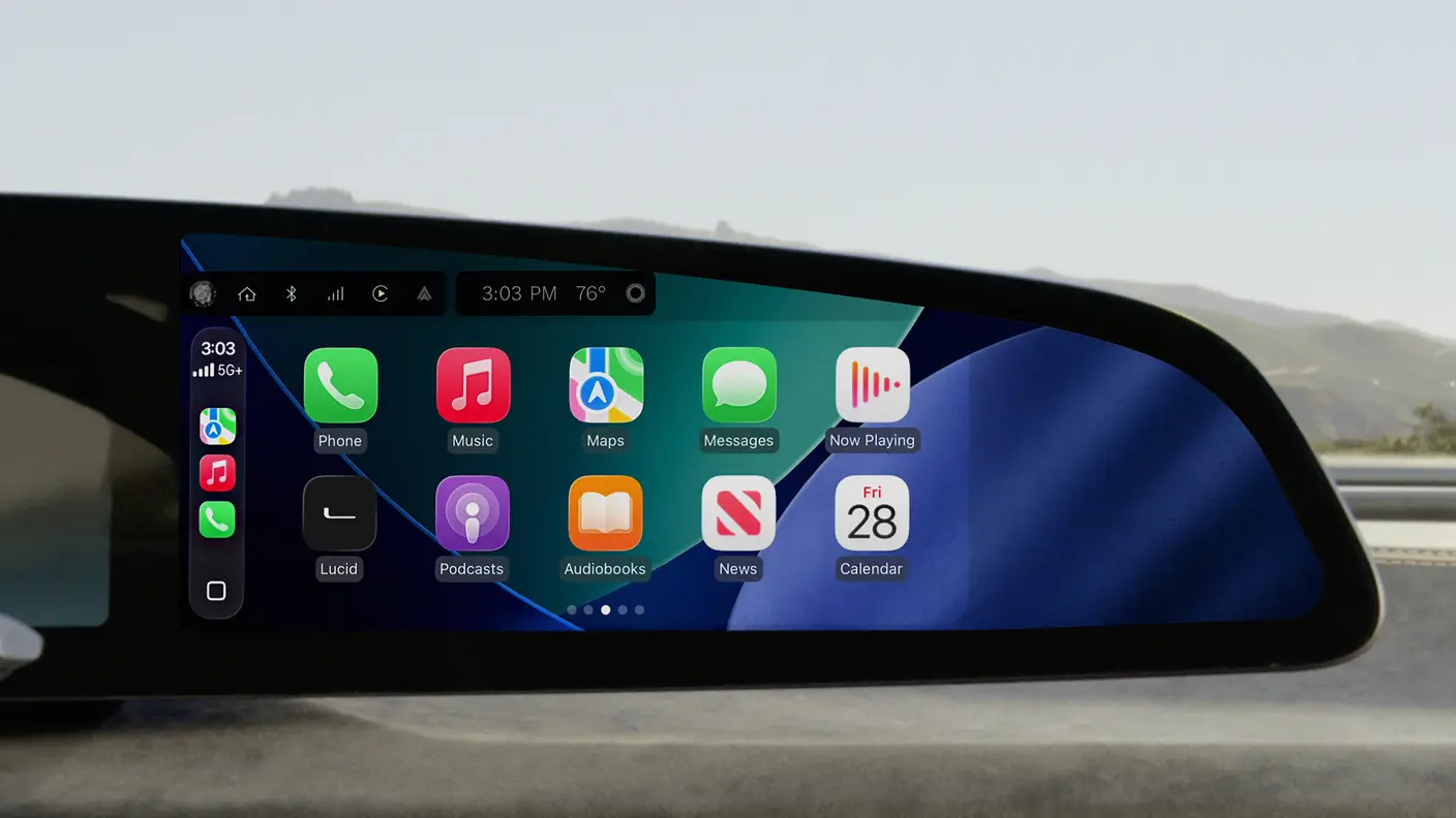 Apple CarPlay interface on a car's dashboard screen showing app icons including Phone, Music, Maps, Messages, Podcasts, and Calendar.