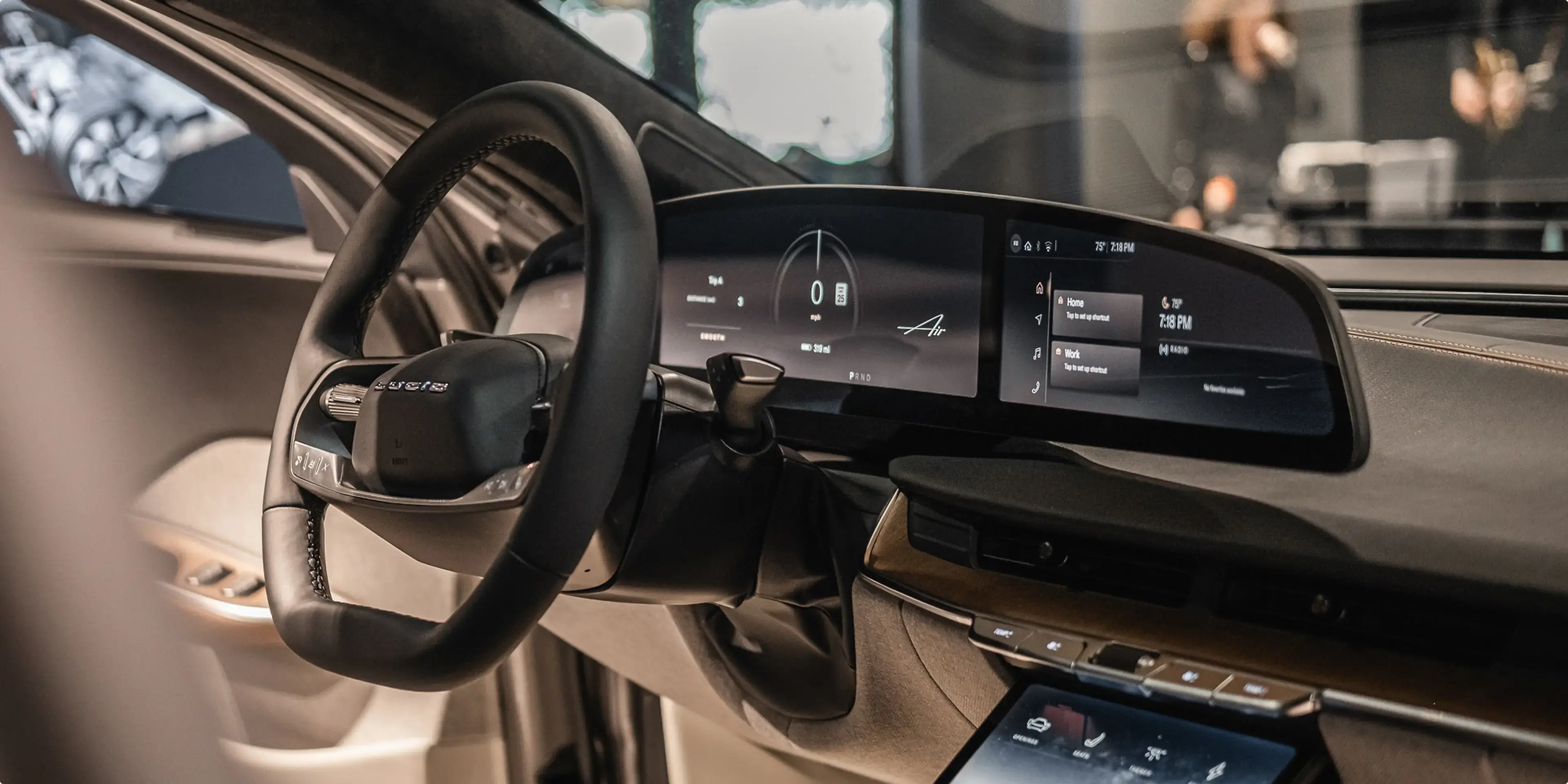 Modern luxury car interior with digital dashboard display, touchscreen console, and leather steering wheel in beige and black.