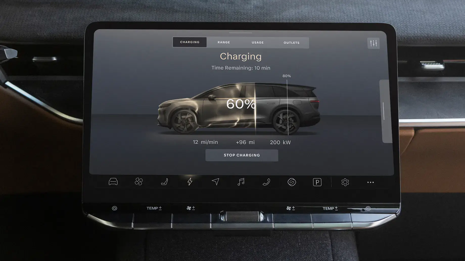 Electric vehicle dashboard display showing 60% battery charge with 10 minutes remaining, adding 12 miles per minute.
