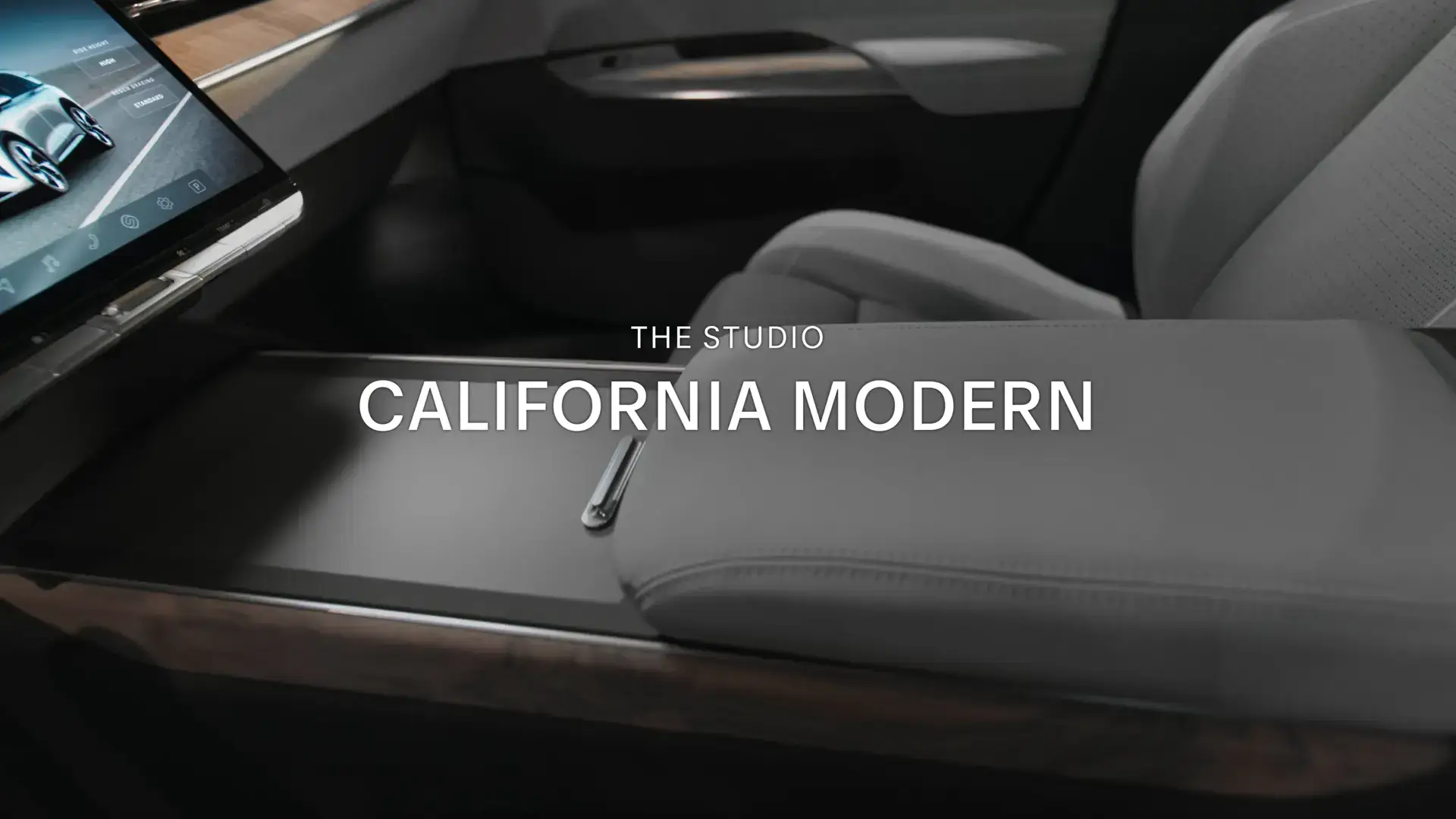 Luxury car interior with digital display and text overlay reading "THE STUDIO CALIFORNIA MODERN"