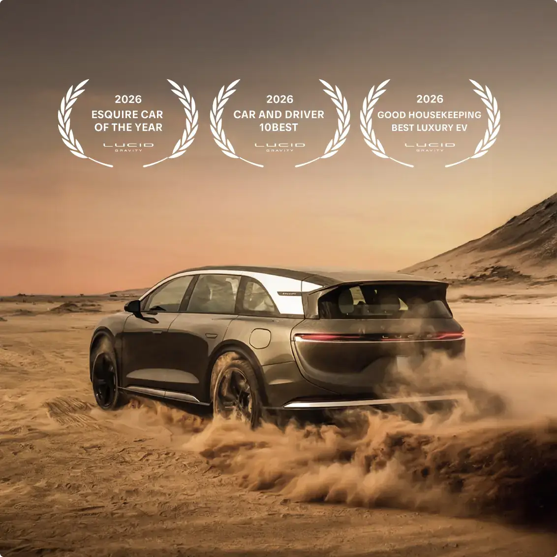 Lucid Gravity SUV driving through desert terrain with dust clouds, showcasing its 2026 award badges for luxury EV excellence.