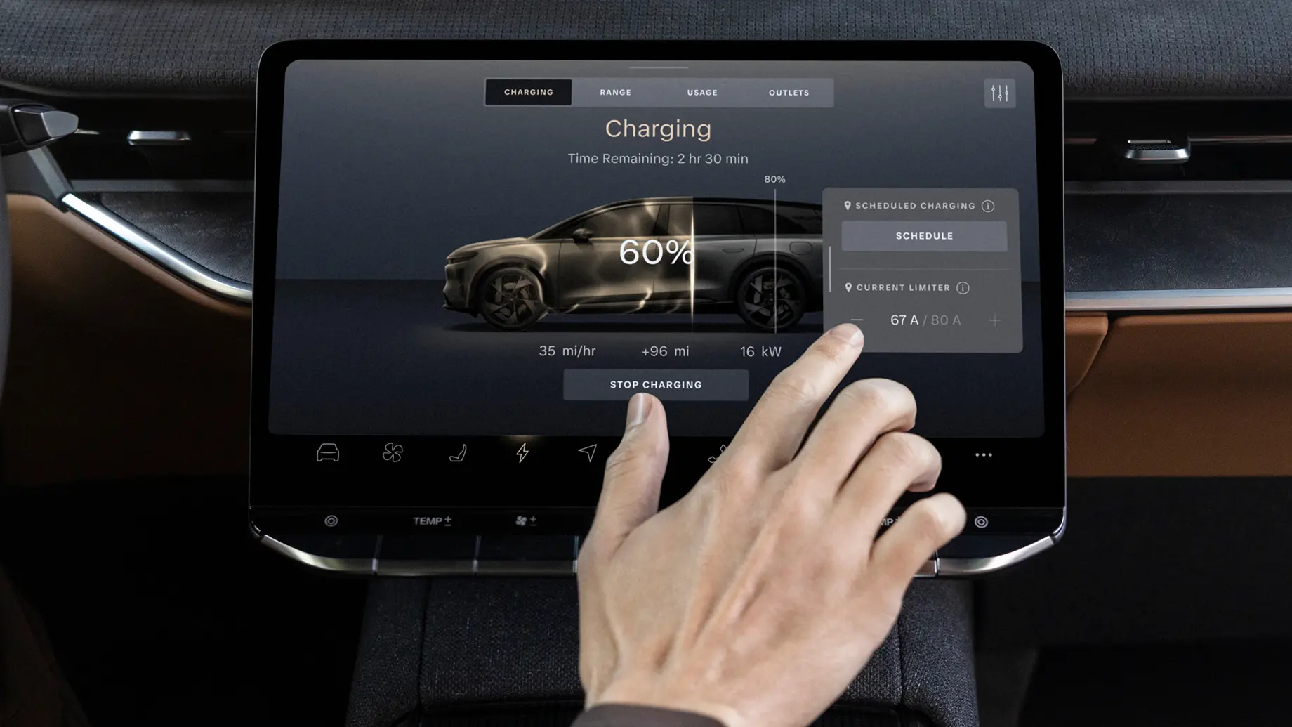 Hand touching an EV touchscreen display showing charging status at 60%, 2 hours 30 minutes remaining, at 16 kW.