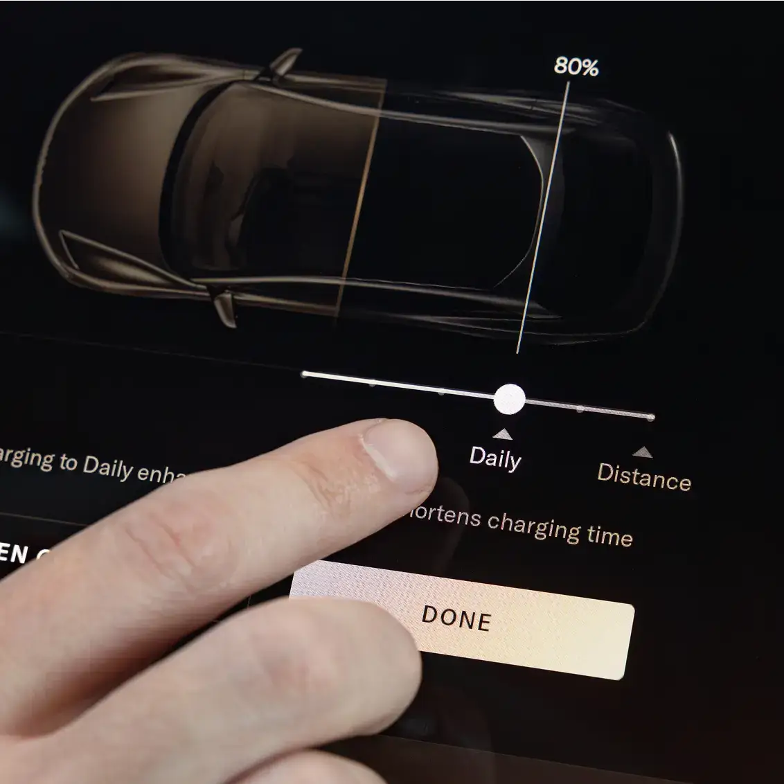 Finger adjusting electric vehicle charging settings on touchscreen display showing car with 80% battery and daily distance options.