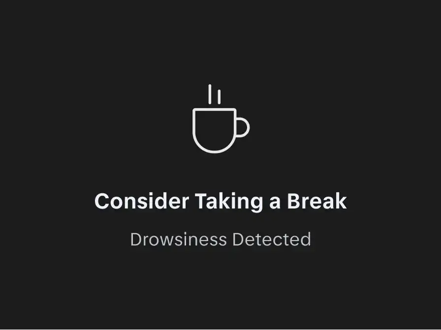 Dark screen with a white coffee cup icon and text reading "Consider Taking a Break" and "Drowsiness Detected."
