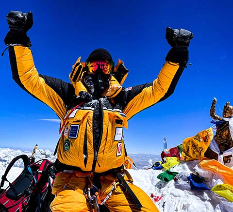 Andrew Hughes on top of Mt. Everest