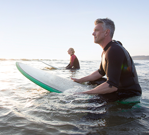 Two people on surfboards