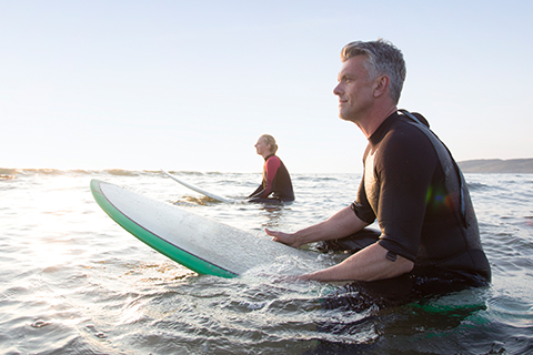 Two people on surfboards