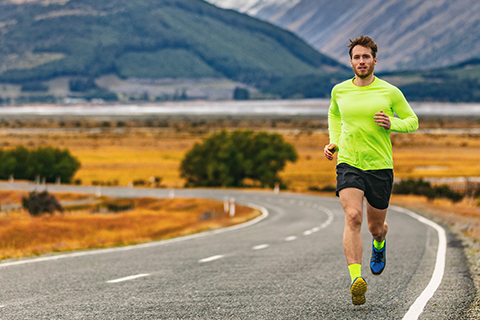 Guy running on the road