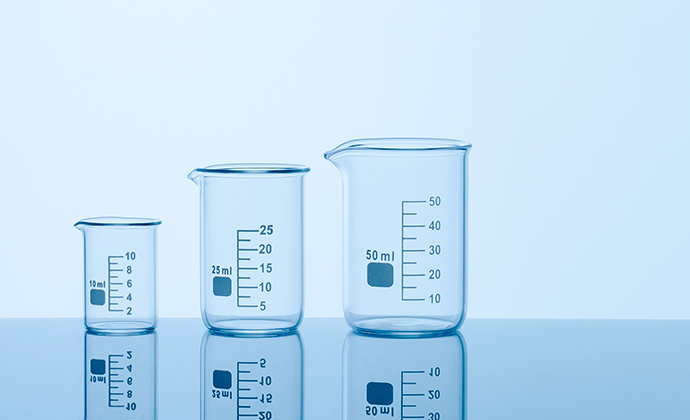 Three differently-sized beakers on a table
