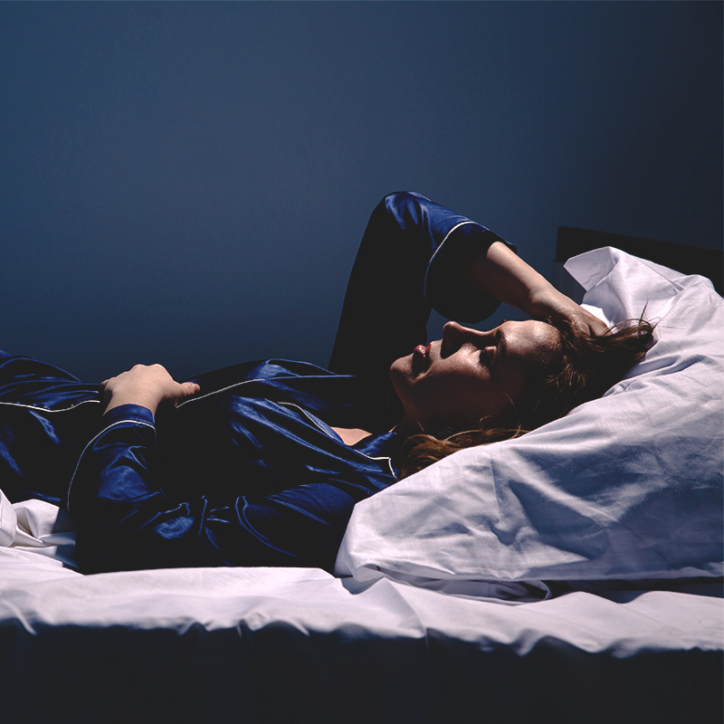 A woman who is unable to sleep through the night.