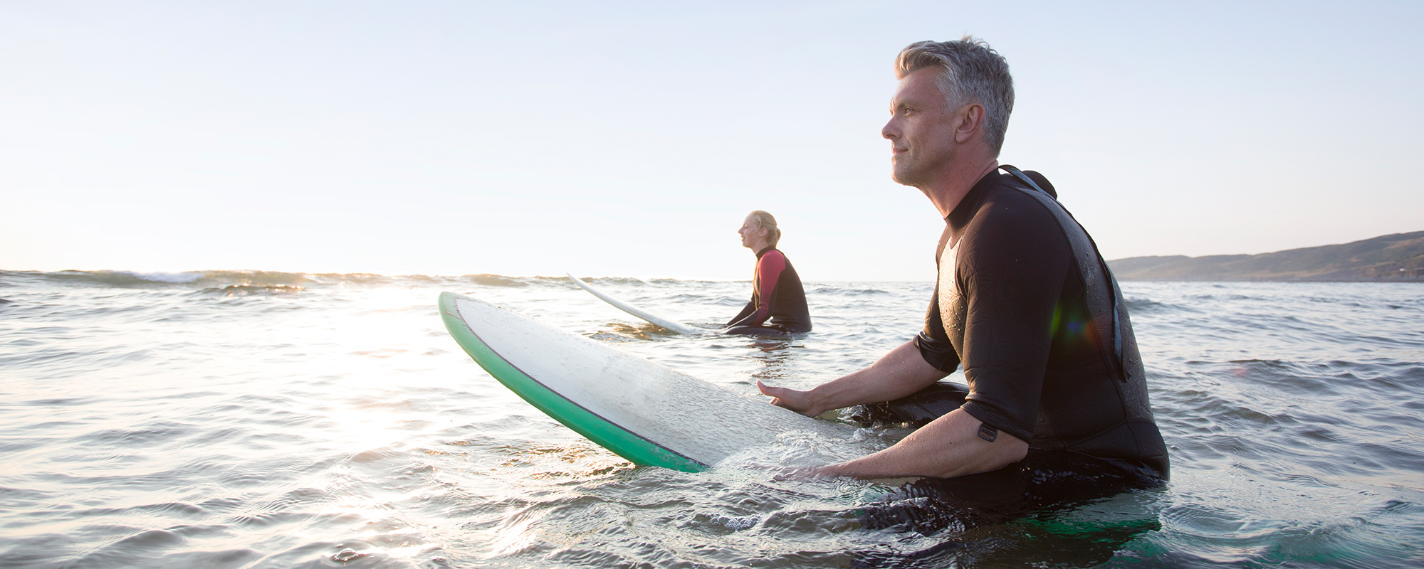Two people on surfboards