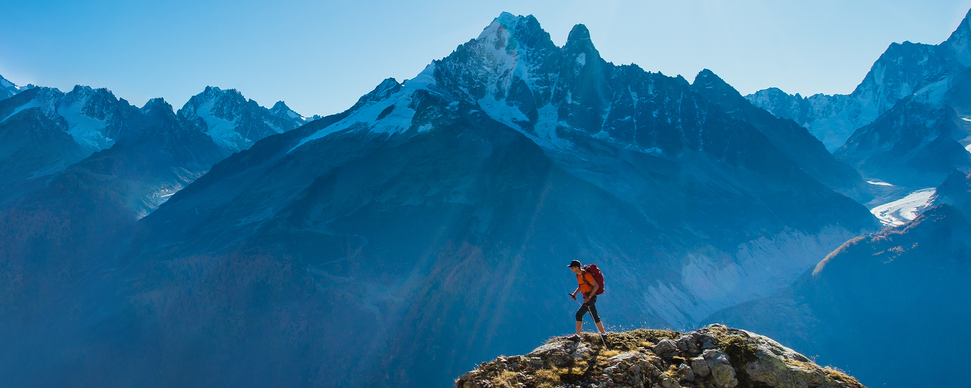 mountaineer summiting a peak