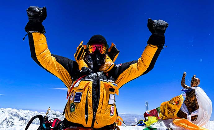 Andrew Hughes on top of Mt. Everest