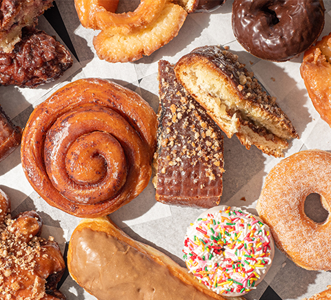 An image of sweets, donuts, and other junk food.