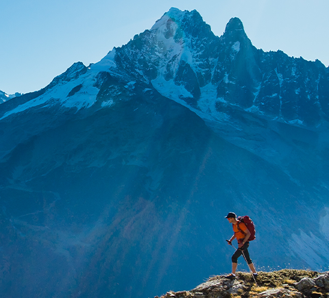 mountaineer summiting a peak