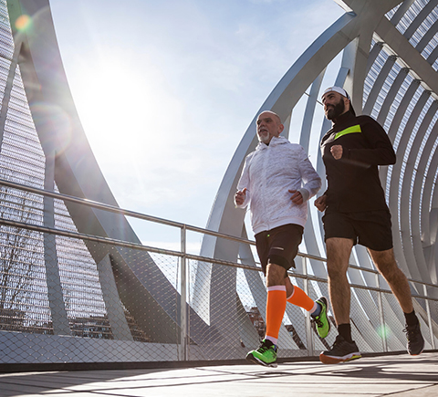 An image of two friends jogging.