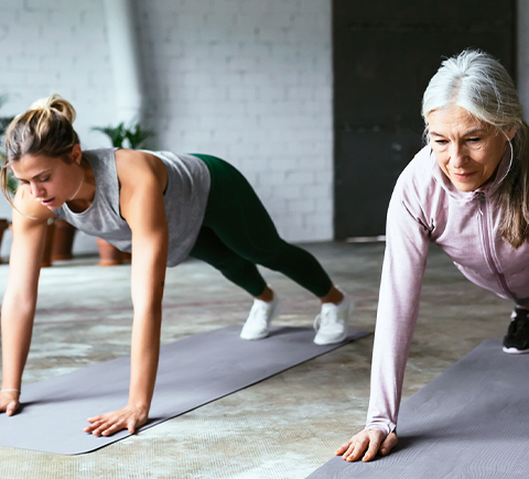 Two women doing push ups