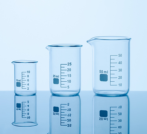 Three differently-sized beakers on a table