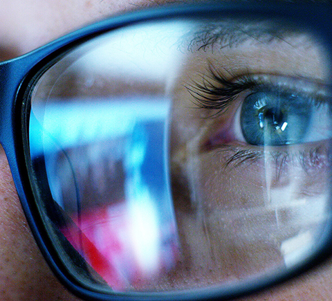 A picture of a blue light exposure on a man wearing glasses.