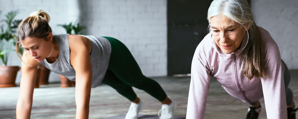 Two women doing push ups