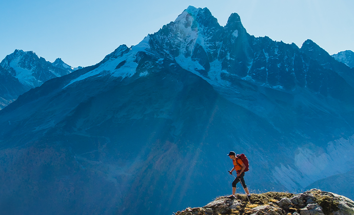 mountaineer summiting a peak