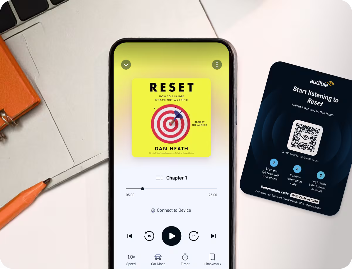 RESET audiobook cover showing in a phone screen with a redemption QR code next to it